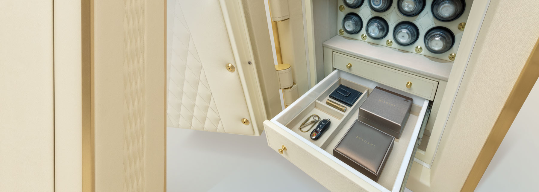 Interior of luxury leather safe featuring custom leather drawers and precision watch winders